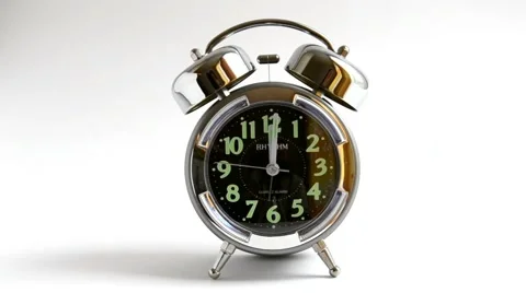 Alarm clock on white background with arrow 12 Stock-Footage 52296819