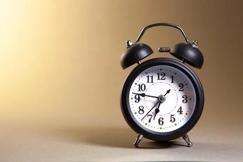 Alarm clock on the white background with copy space Stock Photos
