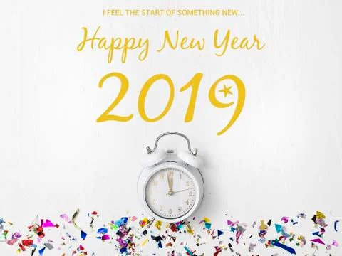 Alarm clock on white background with different colorful new year items Stock Photos