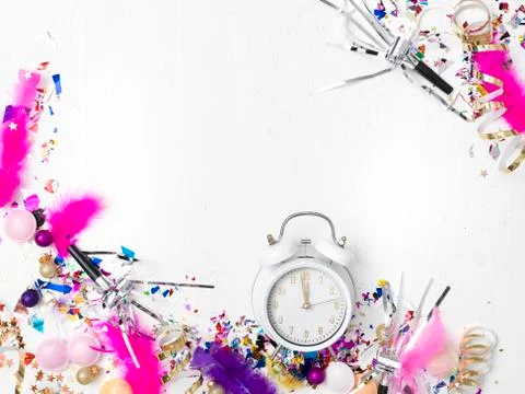 Alarm clock on white background with different colorful new year items Foto stock