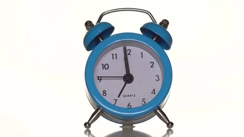 Alarm clock on white background Stock Footage