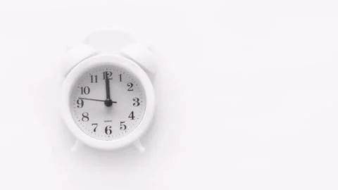 Alarm clock on white background. Space for copy. Minimal concept. Stock Photos