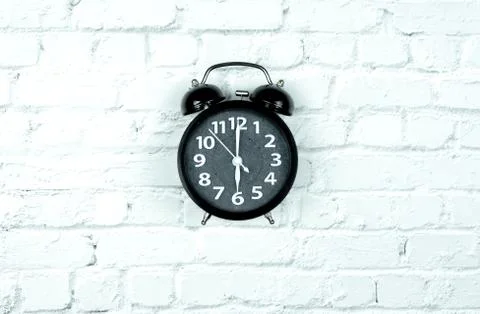 Alarm Clock on white bricks background Stock-Fotos