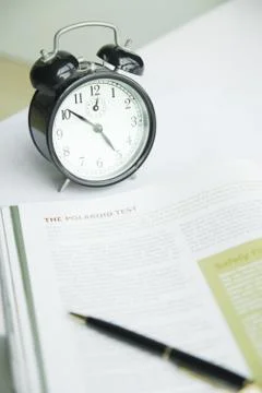 Alarm clock on white table Stock Photos