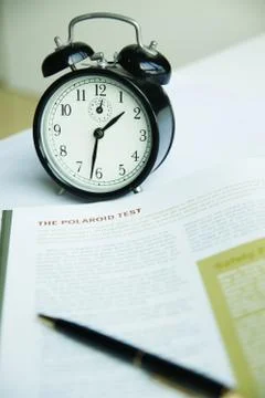 Alarm clock on white table Stock Photos