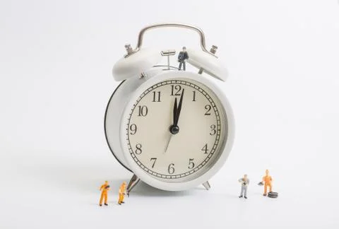 Alarm clock worker on white background Stock Photos