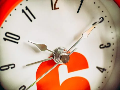 Alarm clocks pointers close up macro shot. Deadline and hurry concept. Daily Stock Photos