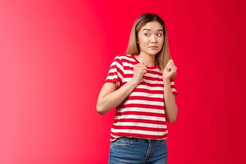 Alarmed silly blond asian girl wear striped t-shirt stay away suspicious person Stock Photos