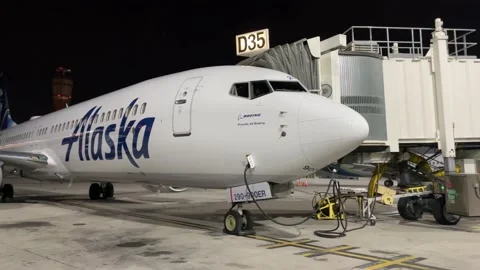An Alaska Airlines Plane Sits Empty At An Airport Stock Footage 145660173