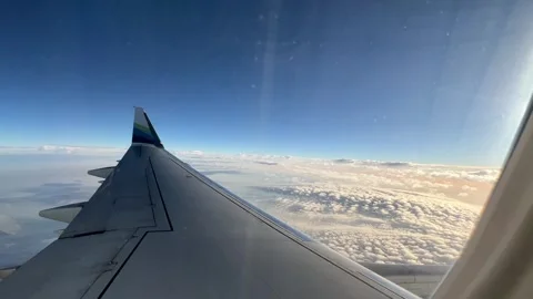 Alaska Airplane Wing Window View During Flight in Clouds Stock Footage 250236306