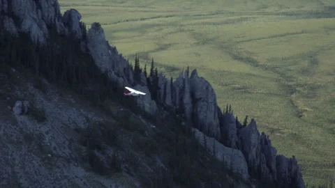 Alaska Bush Plane Flying High Over Craggy Mountains Stock Footage 278755793