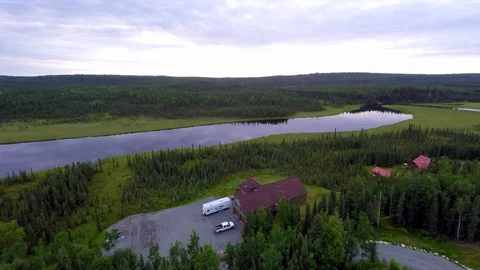 Alaska Moose River Drone flying over house toward glass calm river Stock Footage 78613482