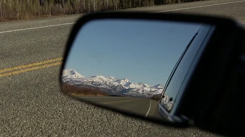 Alaska mountain range in rearview mirror Stock Footage 79012774
