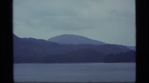 ALASKA USA-1977: A Dark View Of The Ocean And The Mountains Stock Footage 123095015