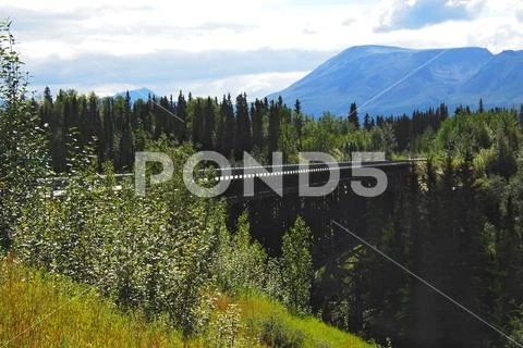 Alaska- Wrangell National Park- View of a Bridge Over a Deep Gorge Stock Photos