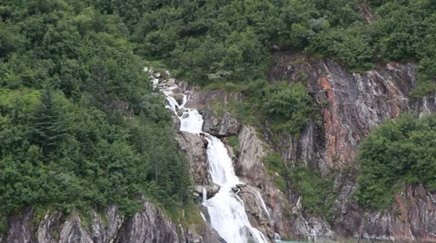 Alaskan Mountain Waterfall Pouring Into The Ocean Stock Footage 33336429