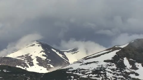 Alaskan Mountains Snow and Clouds Stock Footage