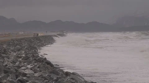 Alaskan Storms - raging waves pan on breakwater Stock Footage 8972370