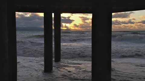 Alaskan Storms - Roiling Breakers Storm Surge Under Pilings Sunset Stock Footage 8972057
