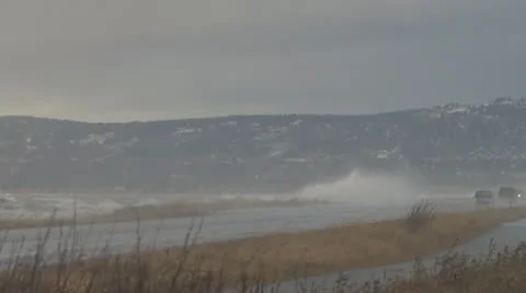 Alaskan Storms - Spit Road 5 1 car Stock Footage 8968844