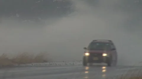 Alaskan Storms - Spit Road 5a 1 car close Stock Footage 8972430