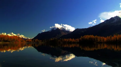 Alaska's reflection lake panning with sun a back light Stock Footage 40451098