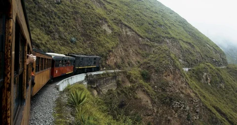 Alausi, Ecuador - March 3 2018: Train driving slowly through mountains Stock Footage 87214713