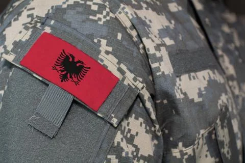 Albania army uniform patch flag on soldiers arm. Military Concept Stock Illustration