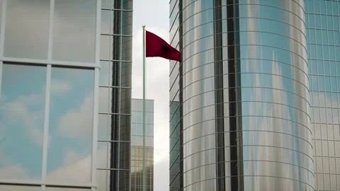 Albania Flag 3D Render Animation on Pole with City Buildings 動画素材 332245897