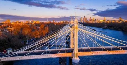 Albert Bridge panoramic view over River Thames at sunset, Chelsea London UK Stock Photos