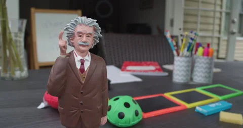 Albert Einstein Figurine and Multi-Sensory Learning Tools on Table. 스톡 동영상 155658978