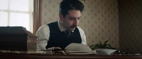 Albert Einstein reading documents - Reenactment Stock Footage 202905280