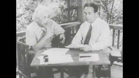 Albert Einstein sitting on the porch of his house Stock Footage 101424762