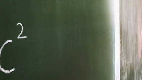 Albert Einstein's theory of relativity formula written with chalk on a Stock Footage 108644749