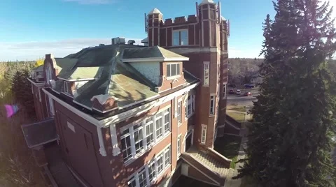 Albert Hall saskatoon. A climbing aerial shot of an old brick school building Stock Footage 43346341
