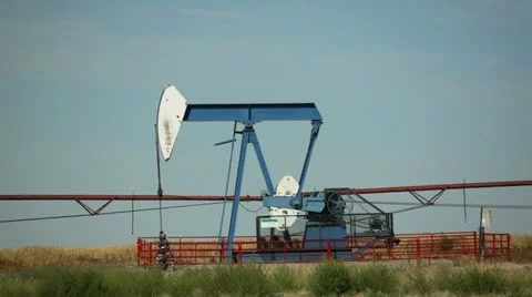Alberta canada - august 18, 2012 nodding donkey oil well pump Stock Footage 11824658