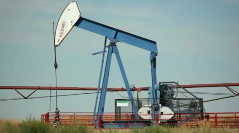 Alberta canada - august 20, 2012 nodding donkey oil well pump Stock Footage 11824691