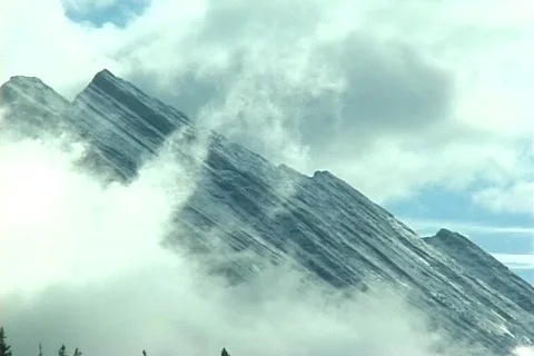 Alberta Mountain Peak and Clouds Stock Footage