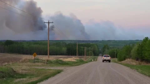 Alberta wildfire intense smoke seen from the highway of Fox Creek, Stockbeeldmateriaal 245171402