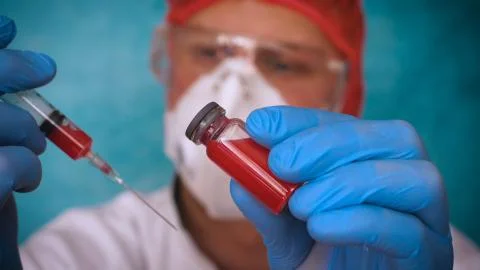 The alchemist checks the test tubes with a test of different compositions. Stock Photos