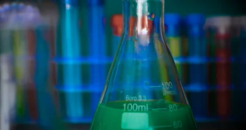 The alchemist, holds the flasks, tests the test tubes Stock Footage 108753838