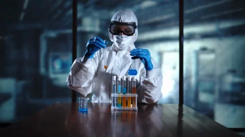 The alchemist, scientist holds the flasks, tests the test tubes in Stock-Footage 95342023