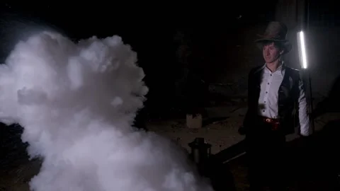 A alchemist splashes water into liquid nitrogen. A chemical reaction occurs Stock Footage 168260673