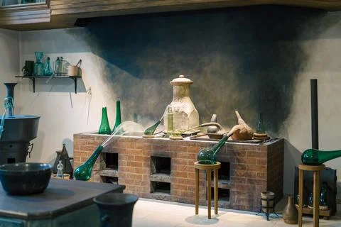 Alchemy in progress at this ancient laboratory with glassware and heating e.. Stock Photos