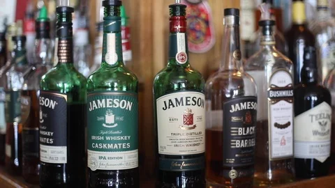 Alcohol assortment behind a bar Stock Footage 114675479