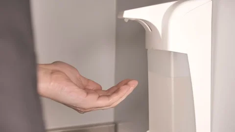 Alcohol-based sanitizer extracted on a man's fingers/hand Stock-Footage 124379524