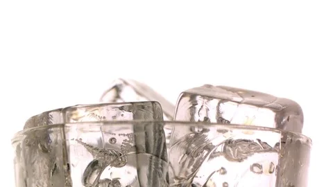 Alcohol being poured on the ice cubes in slow motion Stock Footage 81229516