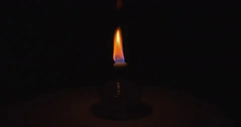 Alcohol burner flame put out in the dark Stock Footage 153403965