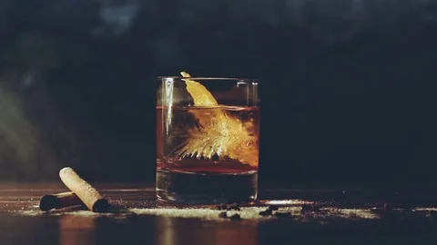 Alcohol cocktail with ice cubes on a bar Stock Footage 81707230