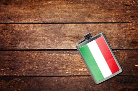 Alcohol flask on the table with flag Stock Photos